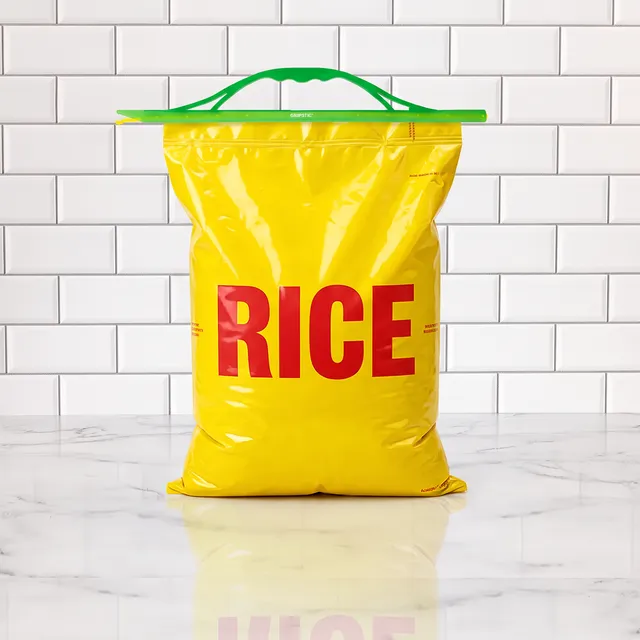 Green GRIPSTIC Heavy Duty Handle sealing a big yellow bag of rice